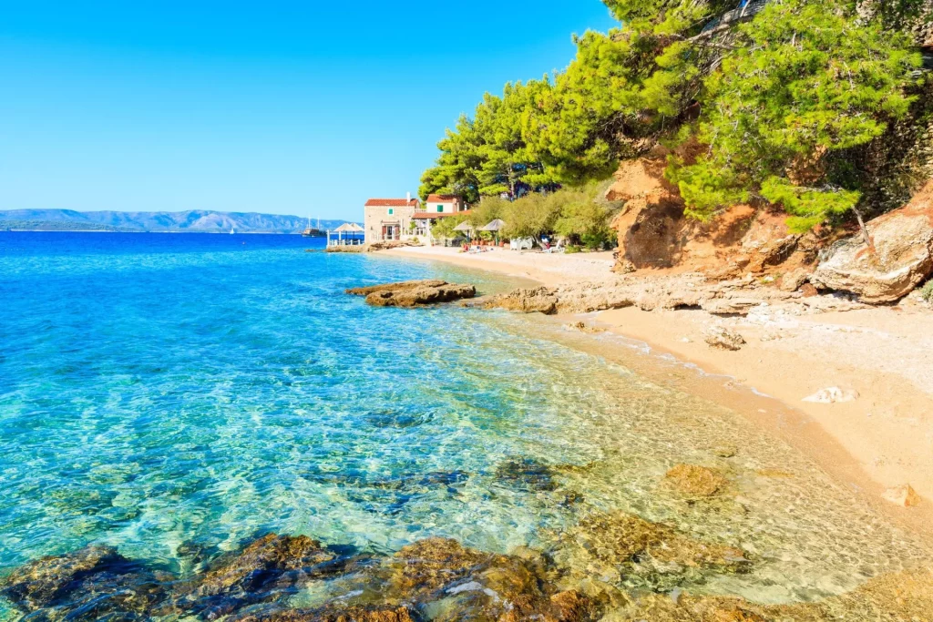 idyllic beach on coast of brac island near bol town brac island croatia stockpack adobe stock scaled