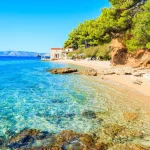 idyllic beach on coast of brac island near bol town brac island croatia stockpack adobe stock scaled